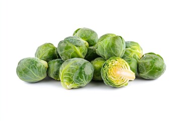 Fresh brussels sprouts clustered on a white background.