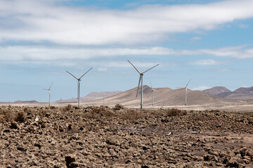 Wind turbines harnessing energy in Fuerteventura's arid landscape