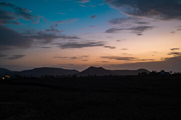 Beautiful sunset over Fuerteventura mountains with vibrant colors and clouds