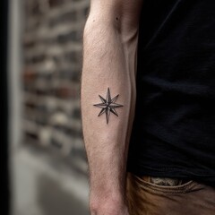 Obraz premium Small, intricate star tattoo design on a forearm.