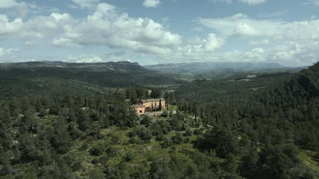 Picturesque view of the catalan hermitage mare de deu de pinyeres, nestled amidst the serene landscape of el priorat, catalonia, showcasing the tranquil beauty of the region