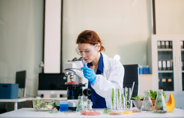 Scientist analyzing food samples in modern lab with advanced equipment for safety, nutrition, and biotechnology research.