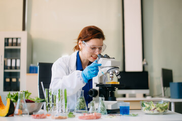 Scientist analyzing food samples in modern lab with advanced equipment for safety, nutrition, and biotechnology research.
