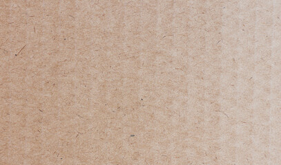 Rustic brown paperboard. Rough cardboard kraft texture
