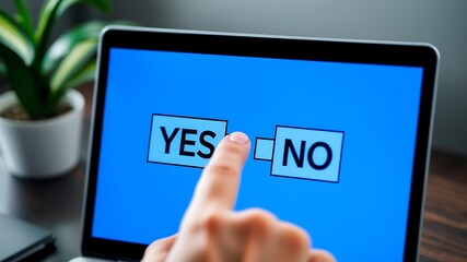 Finger selecting yes option on laptop screen representing a decision or choice