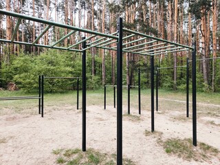 Fototapeta premium horizontal bars, outdoor sports ground for workout in the park. sports ground for workout in the park. workout area without people.