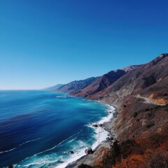 Obraz premium Scenic California Coastline View from Above with Turquoise Ocean Water and Rugged Mountains on a Sunny Day