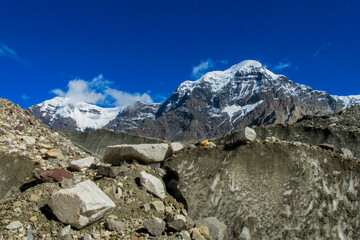 Obraz premium Tian Shan mountains snow peaks and steep slopes in Kazakhstan and Kyrgyzstan border with China. South Inylchek glacier, Enilchek Khan Tengri and Pobeda Victory peak base camp in Pamir mountain range