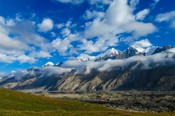 Fototapeta premium Tian Shan mountains snow peaks and steep slopes in Kazakhstan and Kyrgyzstan border with China. South Inylchek glacier, Enilchek Khan Tengri and Pobeda Victory peak base camp in Pamir mountain range
