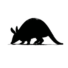 Solid black silhouette of an armadillo digging