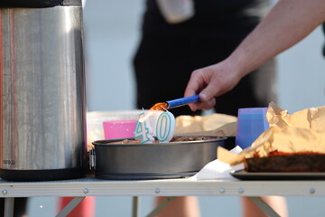 lighting the 40th birthday candles on the cake