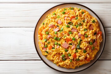 Savory egg omelet with rice, ham, peas, and carrots