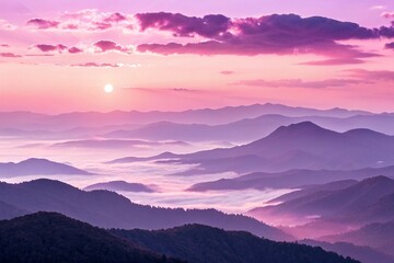 Obraz premium Pink and Purple Sunrise Over Misty Mountain Ridge.