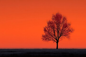 Silhouette tree against vibrant sunset background