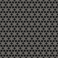 Abstract seamless pattern in asian style. Vector floral geometric ornament.  Black and white ornamental texture with small stars, flowers, diamonds, grid. Oriental background. All-over modern design