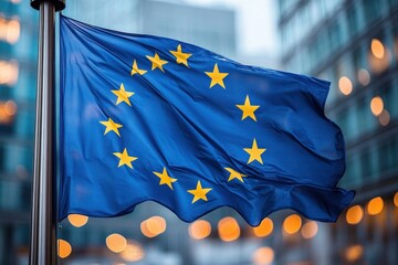 Blue flag with twelve yellow stars in a circle waving in the wind with blurred urban buildings and lights in the background