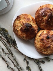 Traditional Easter pastries served on white plate with soft morning light and willow branches perfect for seasonal holiday visuals, baking blogs and Slavic celebration concepts
