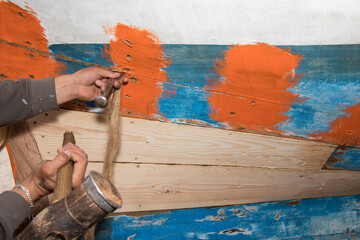 Detail of the hands of a ship's carpenter (