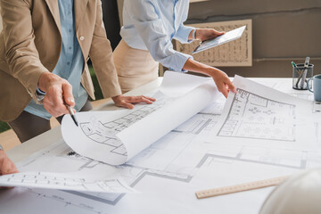 Architects and engineers are in a meeting to discuss and inspect the house designs to meet the...