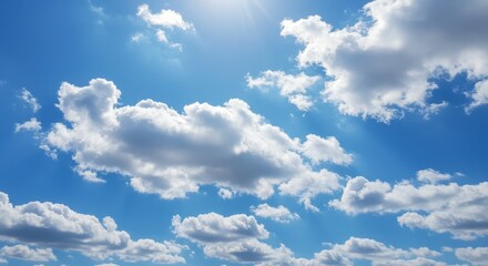 Naklejka premium Clouds in blue sky representing freedom and openness with sunlight and white puffy clouds