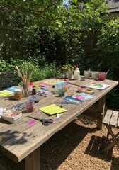 Colorful Craft Supplies on Rustic Wooden Table in Sunny Garden