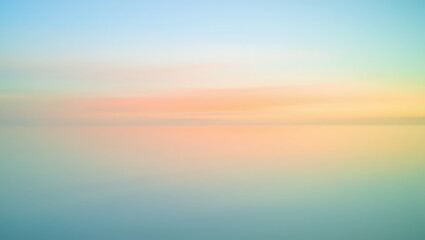 Obraz premium Serene Pastel Sunset Over Calm Water Dreamlike Landscape Photography