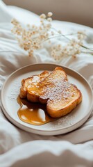 Delicious French toast served with syrup on a cozy plate near delicate flowers in a bright setting