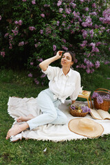 Woman Embraces Fragrant Lilac Blooms In Spring