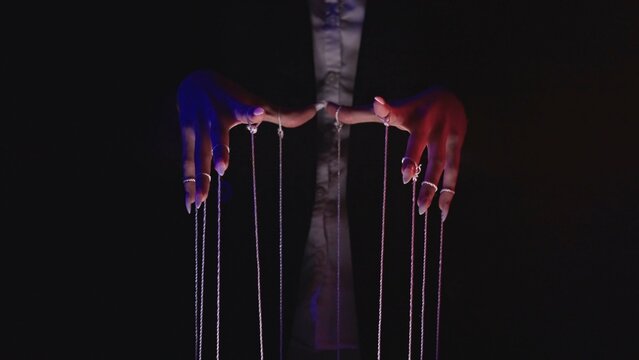 Fototapeta Manipulation and Control through Puppetry Strings in Darkness