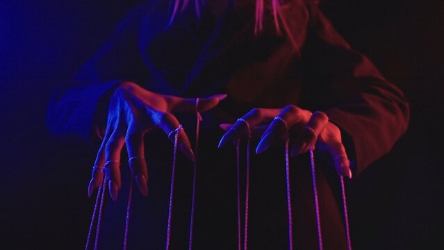 Fototapeta Conceptual Image of Mysterious Hands Controlling Strings