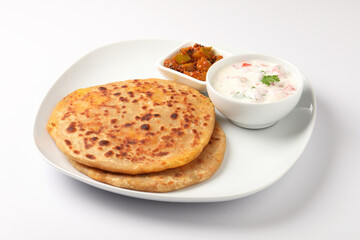 Aloo paratha, Famous Indian dish served with raita and pickle 