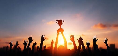 Silhouetted Crowd Cheers Winner Holding Trophy at Sunset Achieving Success Teamwork Goal Celebration