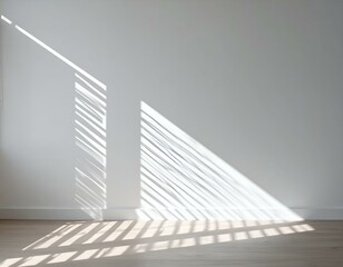 Obraz premium Sunlight streams through blinds, casting dramatic shadows on a white wall and light wood floor. Minimalist interior design.
