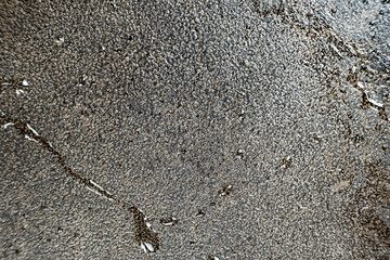 Water droplets on a cast iron macro surface. Cast iron cookware care, rust resistant, abstract pattern