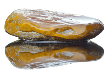 Smooth yellow rock with grey streaks and water reflection is isolated against a transparent background, showcasing its texture and colors