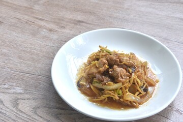 stir fried chicken with slice ginger and black ear mushroom on plate