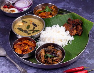 Indian vegetarian thali style dishes, platter and small dishes, banana leaf thali
