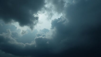 Obraz premium Dramatic Sky Dark Clouds Parting to Reveal a Glimmer of Light