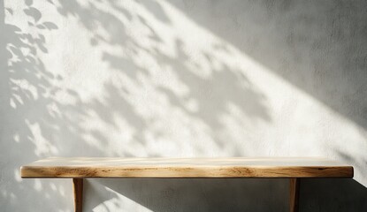 Light-filled wooden shelf with plant shadows