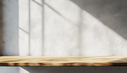 Light-filled, minimalist wooden shelf against a textured wall. Sunlight casts shadows through a window, creating a serene and neutral backdrop