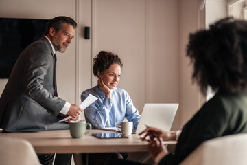 Professional Team Collaboration During Business Meeting in Modern Office