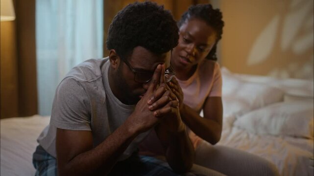 African American family conflict solution wife apologize comforting sad husband couple calming after quarrel argument apologizing ask forgiveness love relationship psychology at home bedroom evening
