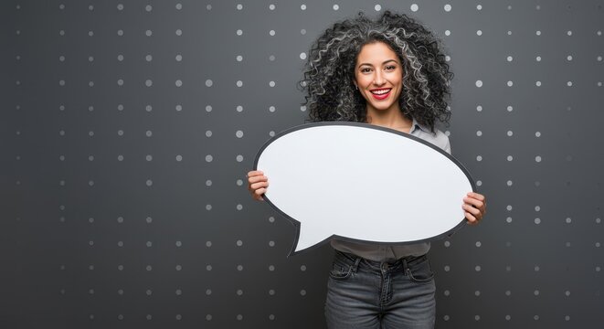 The woman is holding a large white speech bubble. Visual Concept.