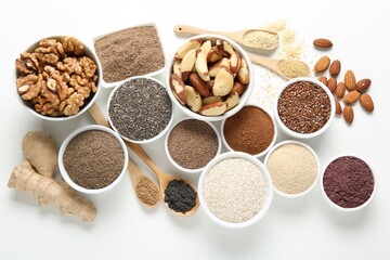 Different superfoods on white background, flat lay