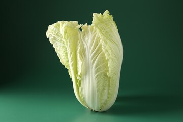 Fresh Chinese cabbage on green background, closeup