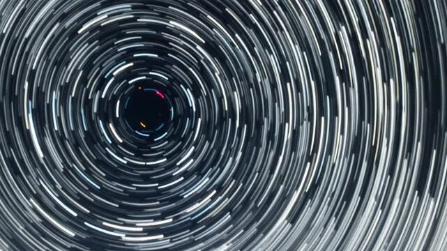 Time lapse of Star trails in the night sky. Stars move around a polar star, vertical footage