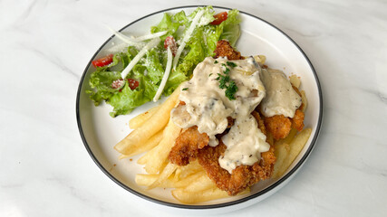 classic traditional italian chicken parmigiana with cheese, tomato sauce meal and french fries