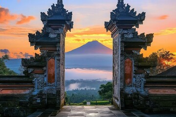 ancient stone gateway framing a distant mountain at sunrise with mist and vibrant orange sky