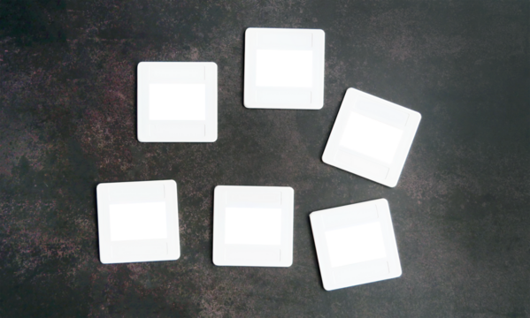 White Plastic Slide Frame Mount for slide film, transparent cutout isolated mock up template, Retro element, nostalgia, photograh, film camera in dark background