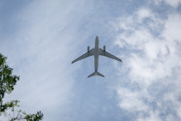 A plane flying against blue sky